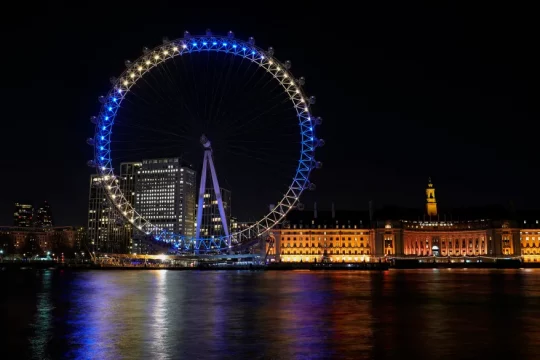 The London Eye is lit up in the colors of the Ukraine flag, in UK. AP
