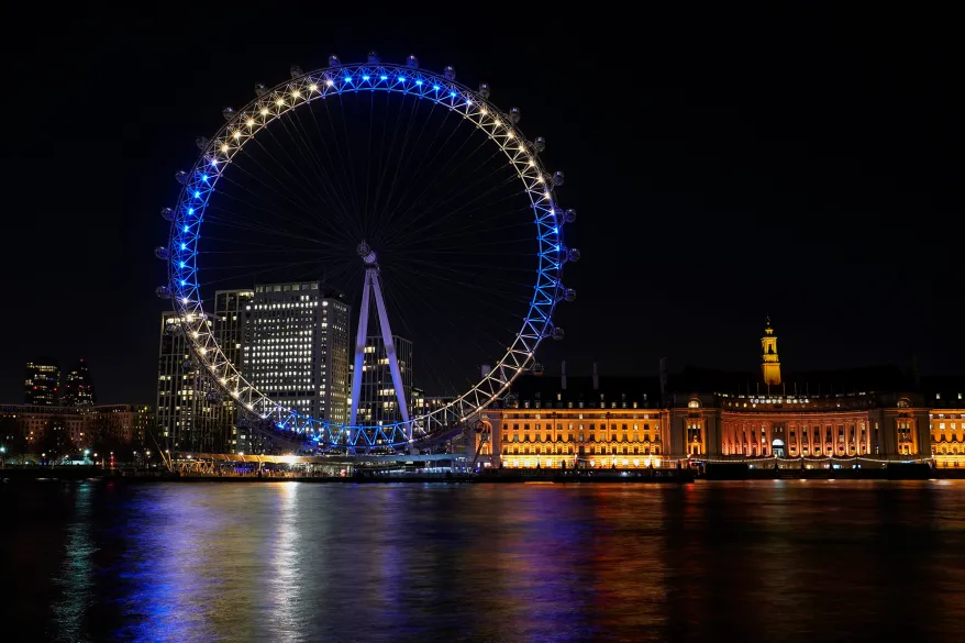 The London Eye is lit up in the colors of the Ukraine flag, in UK. AP